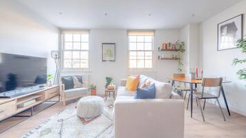 Basic House, Multiple Beds | Living area | TV