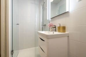 Shower, hair dryer, towels, soap