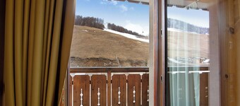 Apartamento 'Chalet Anna Cigambola' con vistas a la montaña, balcón y Wi-Fi