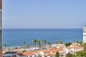 A coastal town with buildings, palm trees, and a beach. - Great Views Studio A84 near the beach with shared pool and Wi-Fi (Torrox)