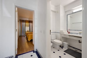 Bathtub, hair dryer, towels