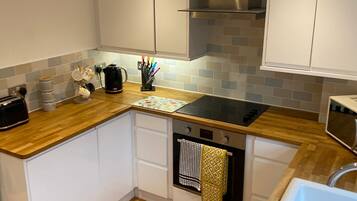 Comfort Townhome | Private kitchen | Dining tables