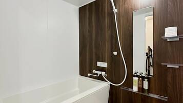 Bathtub, hair dryer, towels, soap