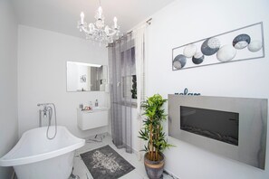 Bathtub, hair dryer, towels
