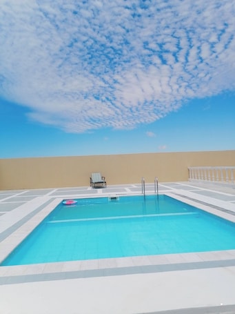 Outdoor pool. Near Beach Property in Ras Madrakah.