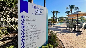 A sign listing amenities at Hideaway Club including SPA, pool, and various activities. - WATERPARK! Mickey & Superhero! EPIC Resort Close 2 Disney! 2730 (Kissimmee)