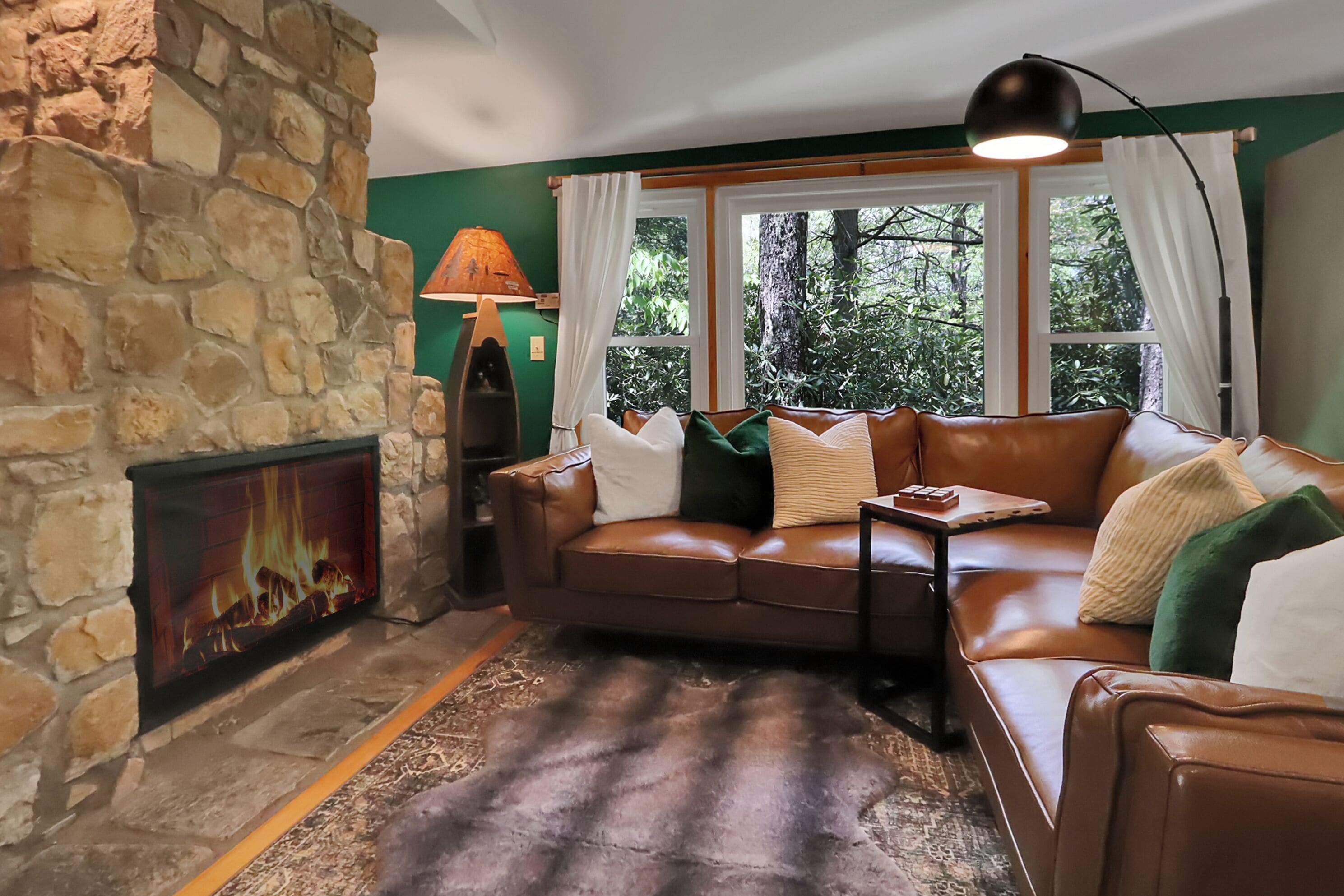 Enjoy comfort on a crisp mountain evening by the stone fireplace.