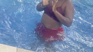 A person in a swimming pool with tiled edges. - LOYALTY HOTEL  (Accra)