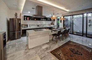 Deluxe Apartment | Private kitchen | Full-size fridge, microwave, stovetop, espresso maker