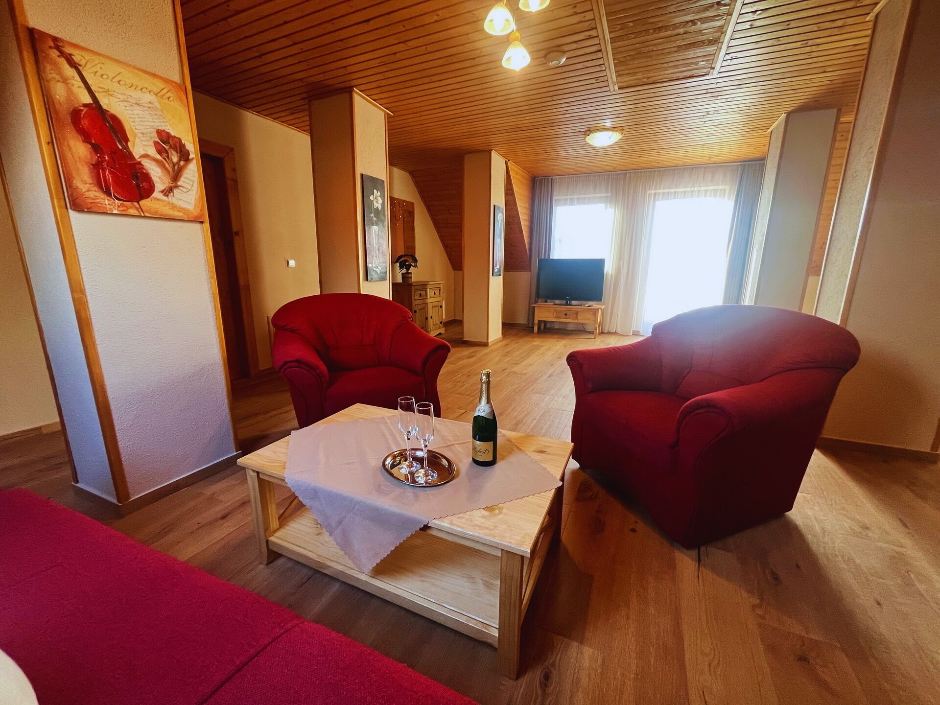 Deluxe Apartment, 2 Bedrooms | Living area | TV, toys, heated floors