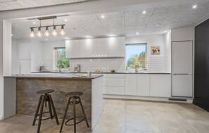 Fridge, stovetop, dishwasher, coffee/tea maker