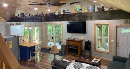 Newly built cabin in cozy wooded setting