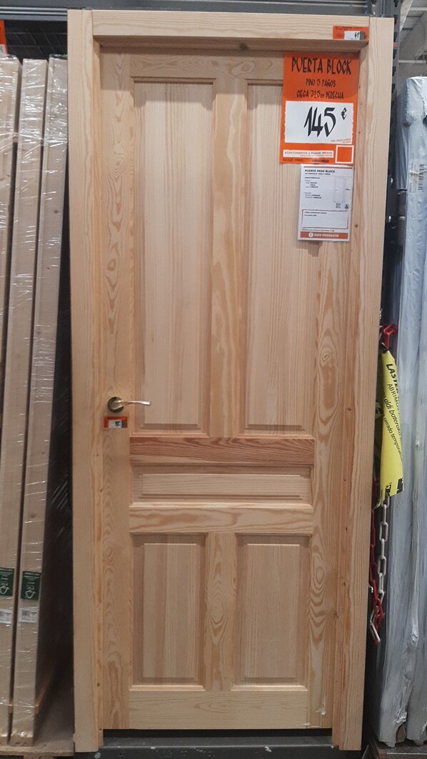 A wooden door with a price tag of 145 euros, indicating it is for sale.