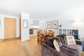 One-Bedroom Apartment with Matterhorn View and terrace | Living area | 108-inch LED TV with cable channels, TV, heated floors - Haus Whymper by Zermatt Premium Apartments (Zermatt)