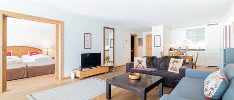 One-Bedroom Apartment with Matterhorn View and terrace | Living area | 108-inch LED TV with cable channels, TV, heated floors