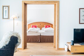 One-Bedroom Apartment with Matterhorn View and terrace | Living area | 108-inch LED TV with cable channels, TV, heated floors - Haus Whymper by Zermatt Premium Apartments (Zermatt)