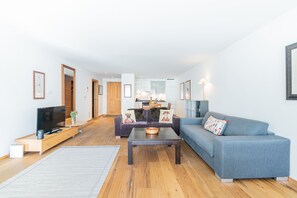 One-Bedroom Apartment with Matterhorn View and terrace | Living area | 108-inch LED TV with cable channels, TV, heated floors - Haus Whymper by Zermatt Premium Apartments (Zermatt)