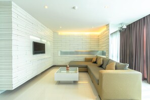 Chambre Exclusive | Coin séjour | Télévision LED de 30 pouces avec chaînes par câble, télévision