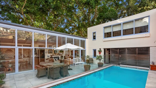 A modern house with a swimming pool, large windows, and outdoor furniture. - Characterful 4BR home w/ pool, full of artwork w/ galleries close by (Paddington)