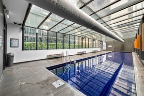 Relax by the pool with a view of the city.