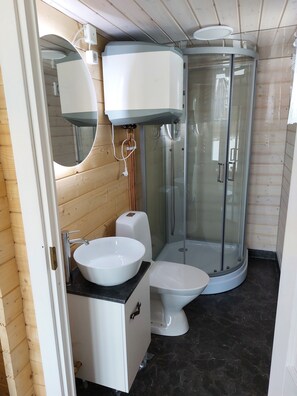 Shower, hair dryer, towels, toilet paper