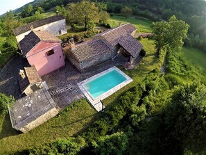 Experience the tranquility of a traditional European-style villa, surrounded by lush greenery and a serene garden.