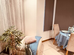 Cozy seating area with a sofa, chair, and table, perfect for relaxation.