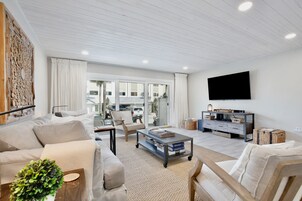 Deluxe Townhome, 2 Bedrooms, Ocean View | Living area | 65-inch Smart TV with cable channels, TV, toys