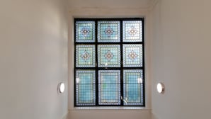 A stained glass window with geometric patterns. - Beautiful 1-bed Apartment in Gateshead (Gateshead)