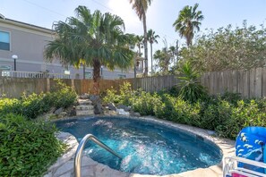 Enjoy a refreshing dip in the pool surrounded by lush greenery and a serene atmosphere.