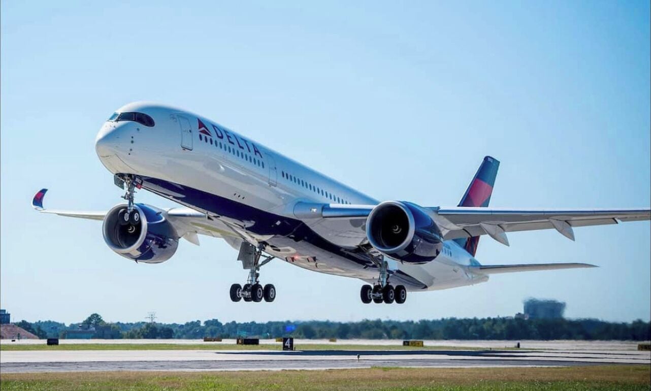 A Delta airplane on the runway.