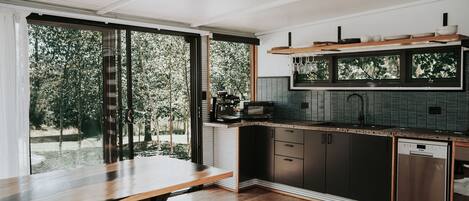 Fridge, dishwasher, coffee/tea maker, cookware/dishes/utensils