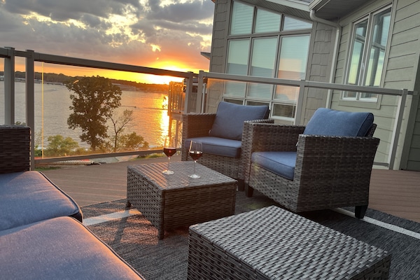 Enjoy expansive views and incredible sunsets from this top floor deck!