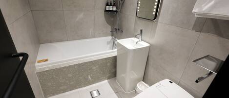 A modern bathroom with a bathtub, a sink, and a toilet. There is a shelf with toiletries and a mirror with lights.