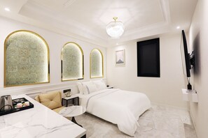 Habitación Deluxe | Ropa de cama de alta calidad y camas con efecto memoria