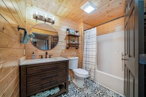 Bathtub, hair dryer, towels