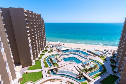 Phase 2: Largest Patio with TV, 4 Loungers and Table.  Large condo 2 Bed/ 2 Bath