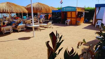 Private beach, beach umbrellas, beach volleyball, beach bar