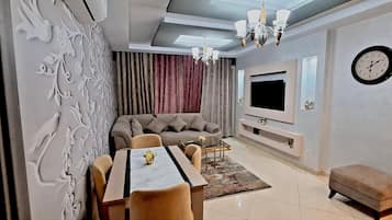 Panoramic Apartment | Living area | 55-inch LED TV with satellite channels, TV