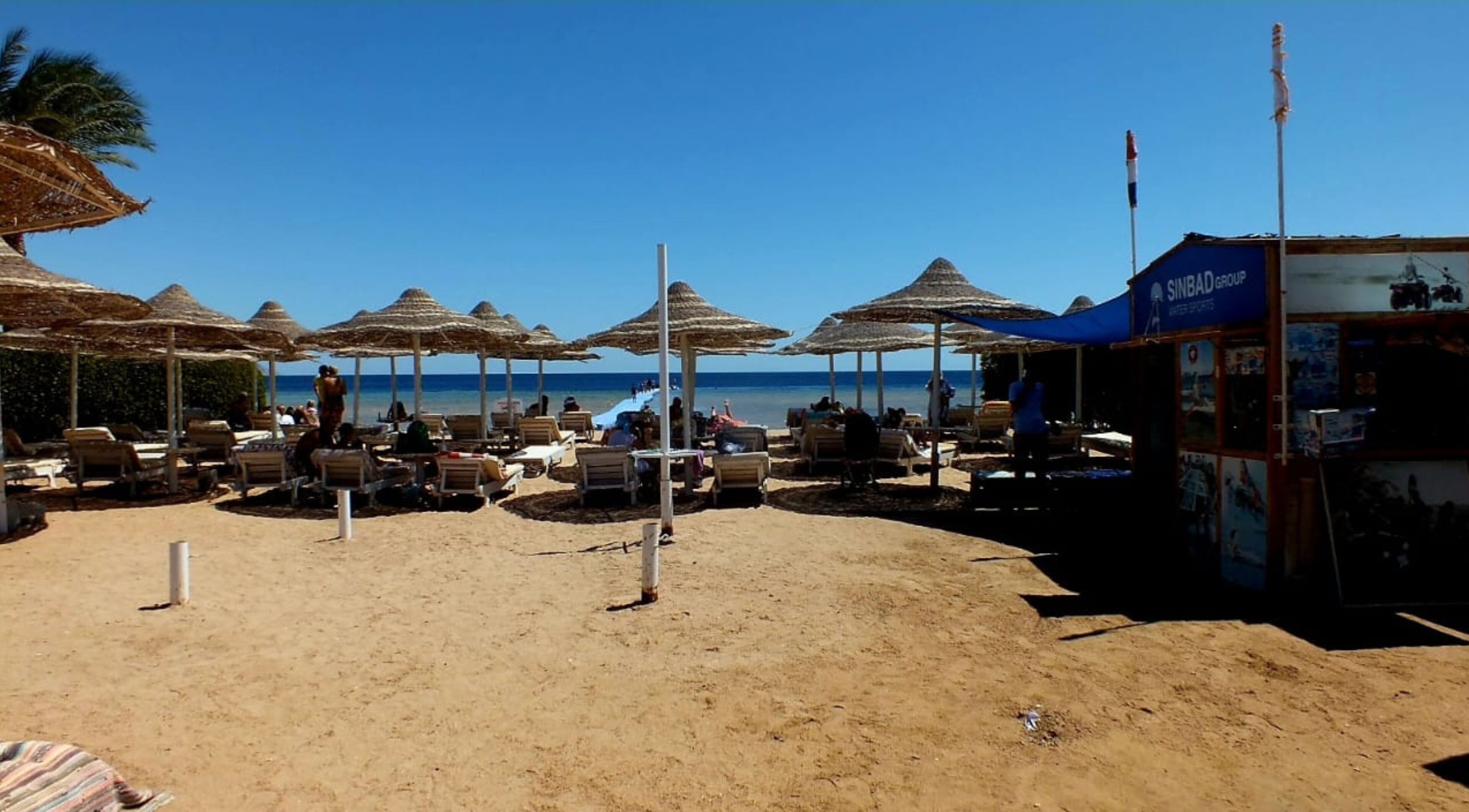 private beach, beach umbrellas, beach volleyball, beach bar