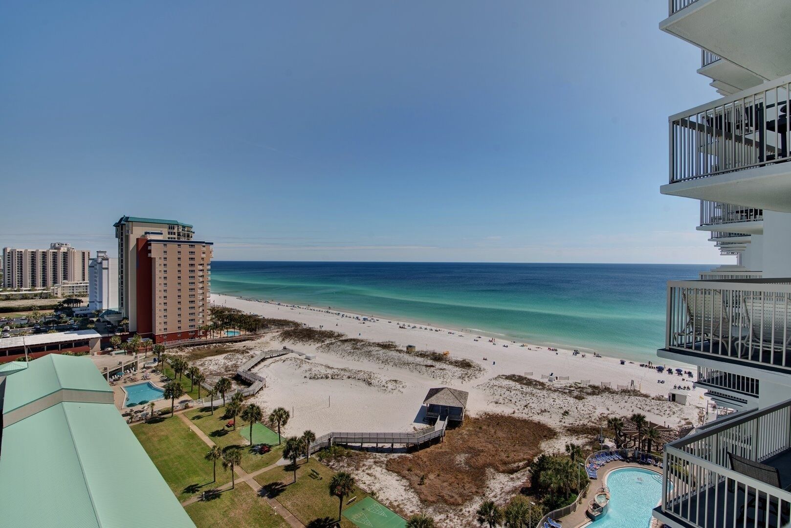 A beachfront hotel with a pool, beach access, and ocean views.