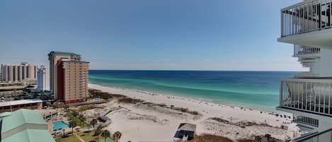 A beachfront hotel with a pool, beach access, and ocean views.