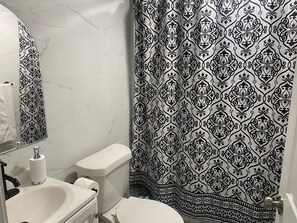 Shower, hair dryer, towels, soap