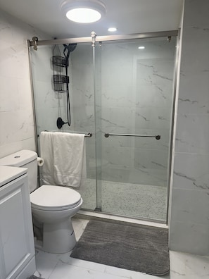 Shower, hair dryer, towels, soap