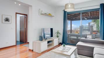 Family Villa | Living area | 42-inch flat-screen TV with cable channels, TV