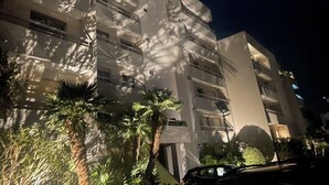 A multi-story building with balconies and a car parked in front. - Extraordinary panoramic  (Bastia)