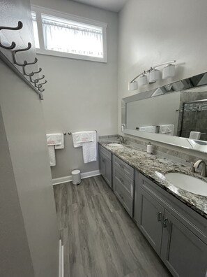 Shower, hair dryer, towels, soap