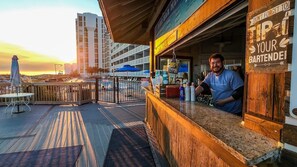 Enjoy a refreshing drink at our outdoor bar with a city view.