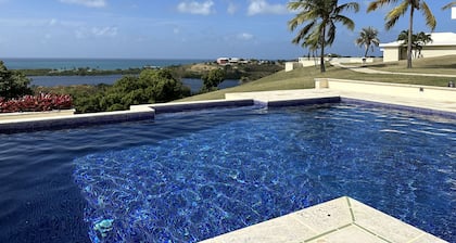 Beautiful 7.7 acre estate with a huge home and stunning views of the Caribbean