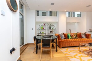 Basic Apartment, Multiple Beds | Living area | TV